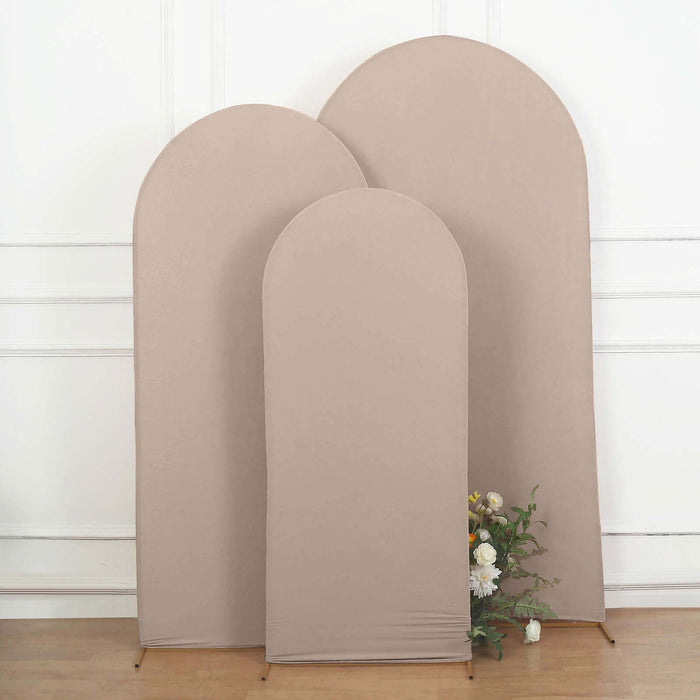 Three beige fabric backdrops in varying heights, styled with flowers.