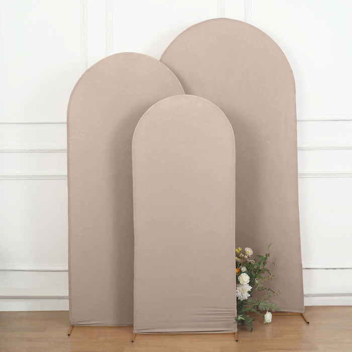Set of three beige fabric backdrops in varying heights for photography.