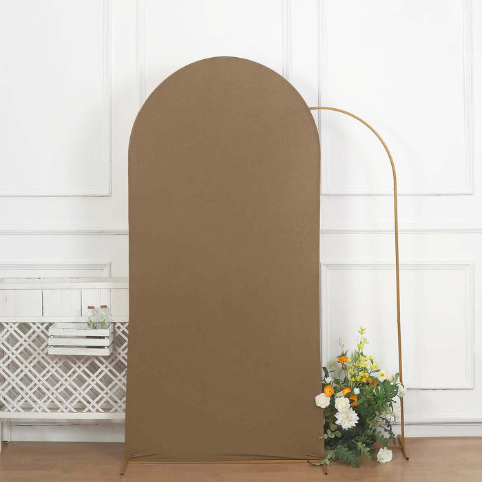 Brown backdrop with gold support and floral arrangement.