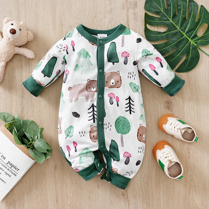 A long sleeve baby jumpsuit with a mixed print of animals and cars, displayed alongside a bear, a pair of shoes, and some children's books.