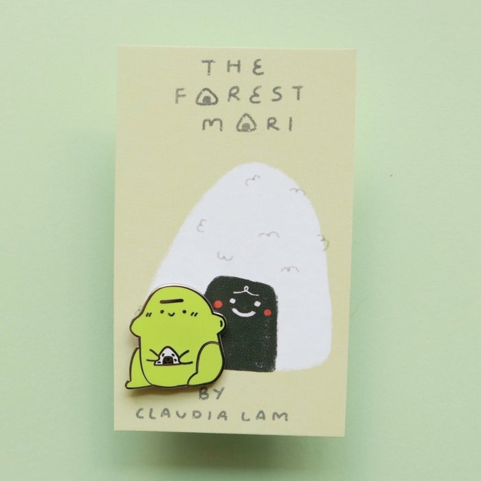 blob frog enamel pin holding rice ball
