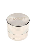 Polished EVRST metal herb grinder with engraved lid logo and textured grip bands