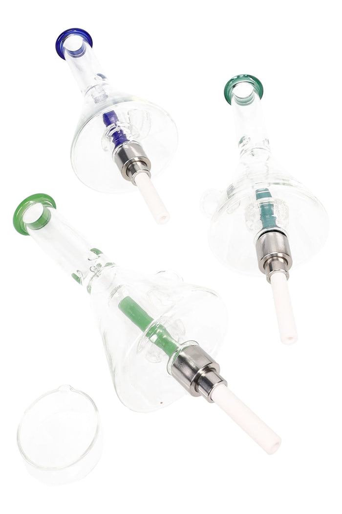 Compact glass beaker dab straw kit with colored mouthpiece accents, showerhead perc, ceramic tip, and glass concentrate dish on white background