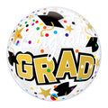 A clear bubble balloon with black and gold graduation cap patterns, multicolored dots, and the text 'GRAD' in gold letters.