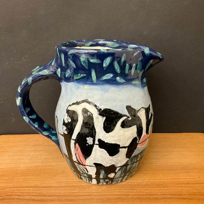 Pitcher with Holsteins on the Fence