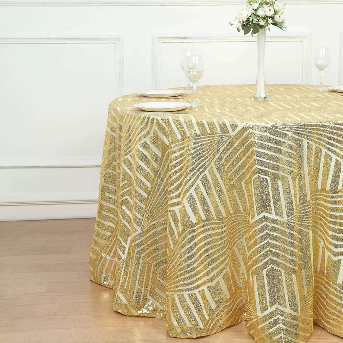 Gold and silver sequined tablecloth on a round table with glassware.
