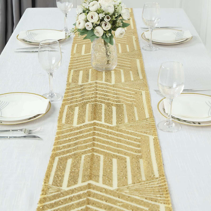 Gold geometric table runner on a dining table with elegant table setting.