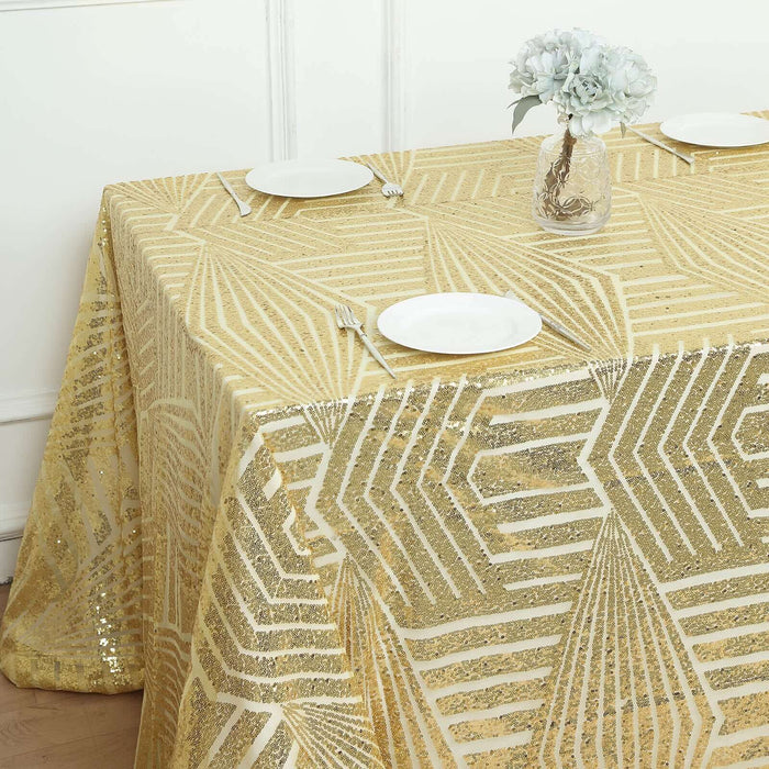 Gold sequin tablecloth with geometric pattern on a dining table.