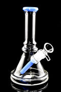 Clear stemless beaker bong with light blue accents, 14.5 mm bowl, and compact tabletop size