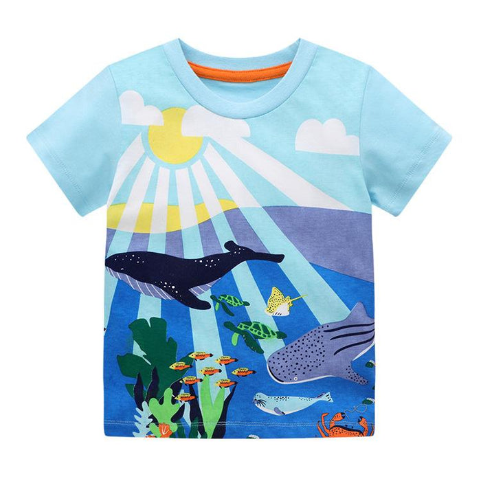 A unisex short sleeve children's t-shirt with a cartoon shark and fish pattern on a blue background.